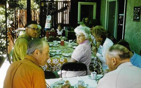 A group of people sitting at a table
Description automatically generated